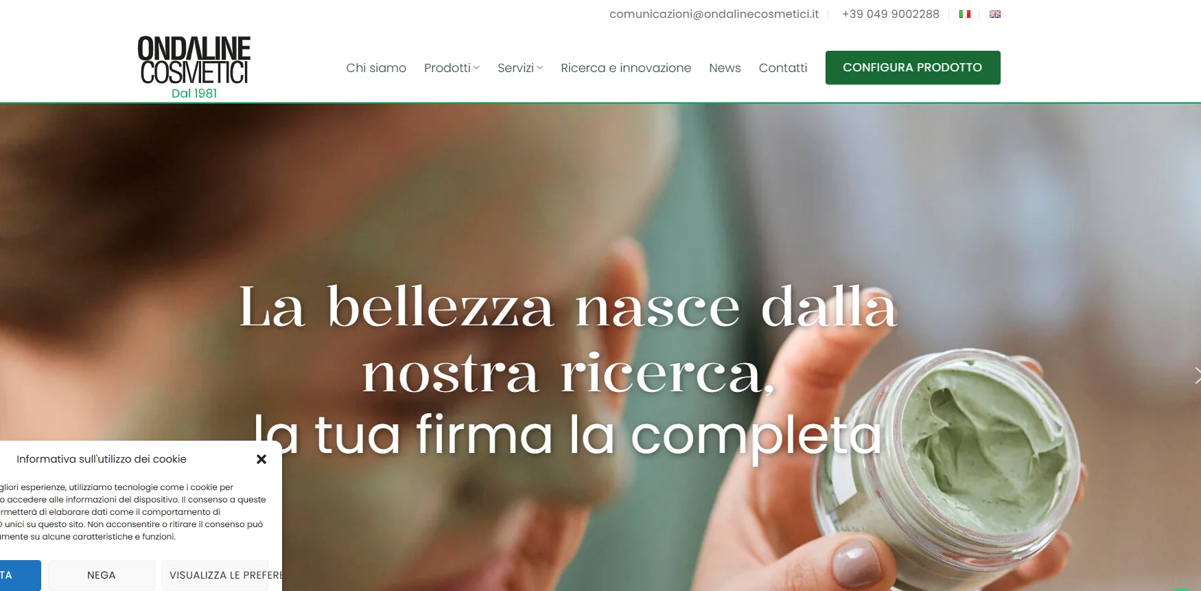 Ondaline Cosmetici website with a hand holding a jar of green skincare cream and Italian slogan highlighting beauty research.